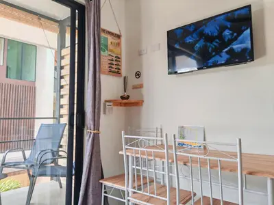 a room with a balcony with a tv on the wall at Moon Home SOUL #1 in Playa hermosa