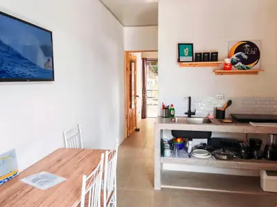a kitchen and dining room with a table and a counter at Moon Home SOUL #1 in Playa hermosa