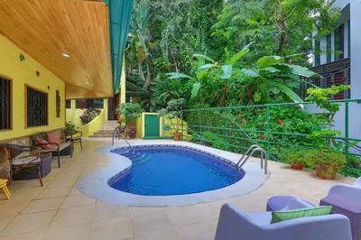 a swimming pool in the middle of a patio at Jungle Creek, Casita Colibri, Studio with Big Patio in Quepos