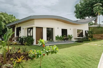 a house with a pitched roof at NEW - Private Villa - Highest Point Manuel Antonio in Manuel Antonio