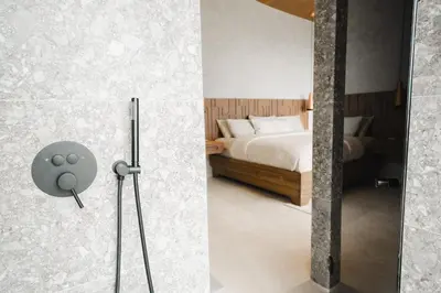 two pictures of a bedroom with a bed and a shower at NEW - Private Villa - Highest Point Manuel Antonio in Manuel Antonio