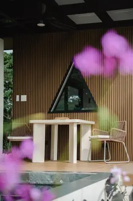 a building with two chairs and a table and a building at NEW - Private Villa - Highest Point Manuel Antonio in Manuel Antonio