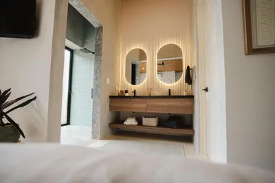 a bathroom with a sink and a mirror at NEW - Private Villa - Highest Point Manuel Antonio in Manuel Antonio