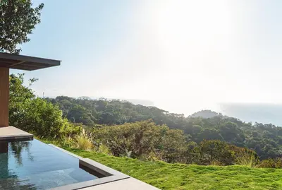 a swimming pool with a view of the ocean at NEW - 360 Private Oasis - Ocean & Jungle Views in Manuel Antonio