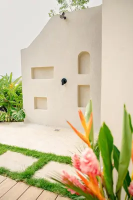 a model of a house with flowers in the foreground at NEW - 360 Private Oasis - Ocean & Jungle Views in Manuel Antonio