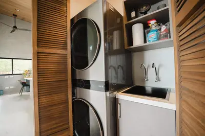 a kitchen with a sink and a microwave at NEW - 360 Private Oasis - Ocean & Jungle Views in Manuel Antonio