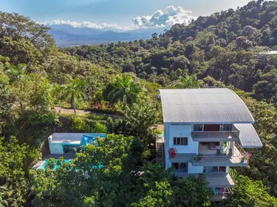 an aerial view of a house in the forest at Lapa Roja, 2BR Ocean View Apartment in Villa Mar y Sol, Nature in Manuel Antonio