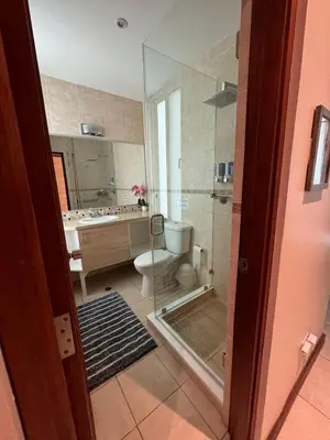 a bathroom with a shower and a toilet and a sink at Beachside 1st Floor Condo Near Flamingo & Conchal in Santa Cruz