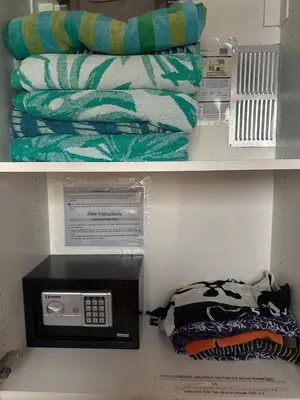 a shelf with a towel next to a microwave at Beachside 1st Floor Condo Near Flamingo & Conchal in Santa Cruz