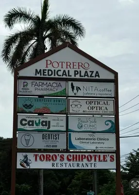 a sign for a medical plaza with a palm tree at Beachside 1st Floor Condo Near Flamingo & Conchal in Santa Cruz