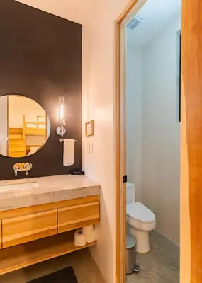 a bathroom with a sink and a mirror at NEW Modern 6BR, Pool, Walk 2 Beach, Sleeps 20 in Playa Guiones