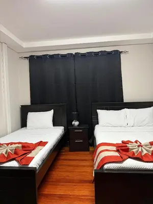 two beds sitting next to each other in a bedroom at Harmony Hotel by Haven in San José
