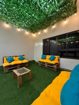 a living room with two couches and a table at Harmony Hotel by Haven in San José
