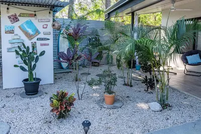 a garden with potted plants on a patio at Casa Cosmo Samara in Sámara