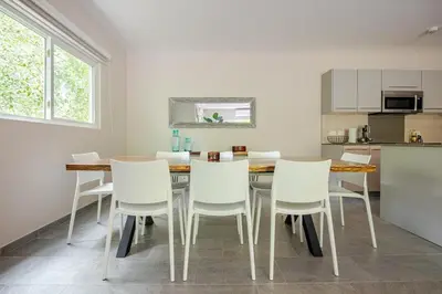 a kitchen and dining room with a table and chairs at Uvita Paradise , Walk to the Ballena Beach in Uvita