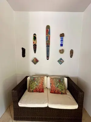 a couch with two pillows and skateboards on a wall at Luxurious Rainforest Retreat in Drake Bay, Osa, Costa Rica in Drake