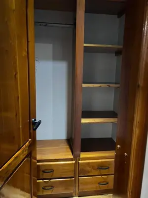 a cupboard with wooden shelves and a door at Luxurious Rainforest Retreat in Drake Bay, Osa, Costa Rica in Drake