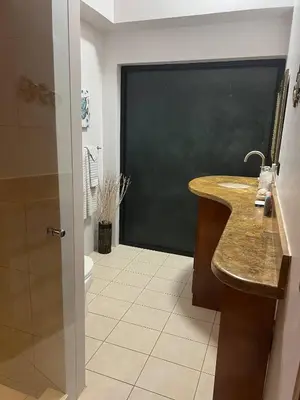 a bathroom with a blackboard and a sink and a toilet at Luxurious Rainforest Retreat in Drake Bay, Osa, Costa Rica in Drake