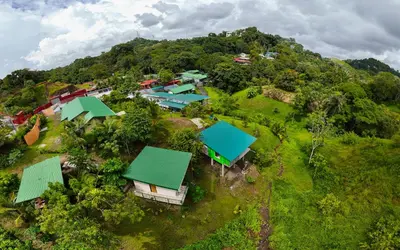 an aerial view of a village on a hill at Kalegio Lodge Full Furnished Apartments in Manuel Antonio