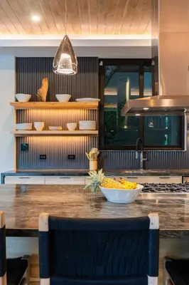 a kitchen with a table with a bowl of food on it at Modern 4BR with Pool, Walk2Beach, Yoga Deck, Sleeps 14 in Nosara