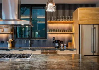 a kitchen with a counter top and a refrigerator at Modern 4BR with Pool, Walk2Beach, Yoga Deck, Sleeps 14 in Nosara