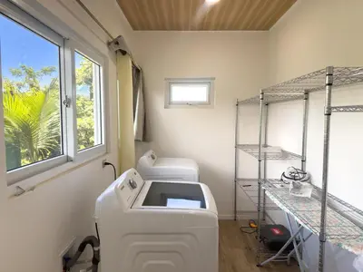 a hospital room with a washing machine and a window at Playa Hermosa 44 - Beach House Getaway in Playa Hermosa