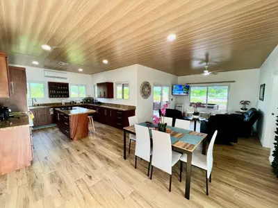a kitchen and living room with a table and chairs at Playa Hermosa 44 - Beach House Getaway in Playa Hermosa