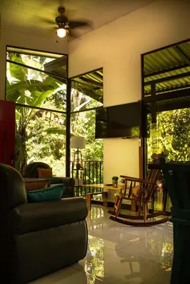 a living room with a couch and chairs at Rio Breeze