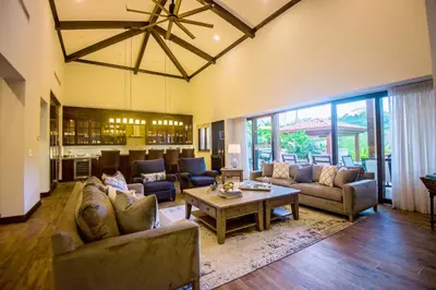 a large living room with couches and a table at Casa Aurora 5 bdr private pool in Los Sueños in Herradura