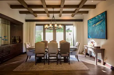 a dining room with a table and chairs at Casa Aurora 5 bdr private pool in Los Sueños in Herradura