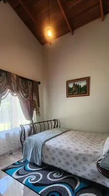 a bedroom with a bed and a window at A place to create dreams in Naranjo