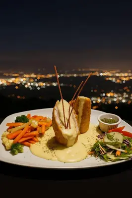 a plate of food with carrots and bread and sauce at Hotel Mirador Mayday Mountain View in Alajuela City