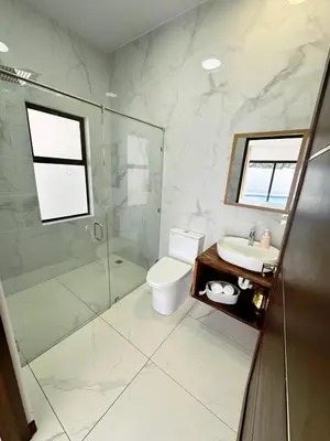 a bathroom with a toilet and a shower and a sink at Luxury Home Tamarindo 3BR- 4BA and Private Pool in Tamarindo