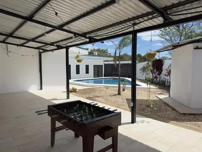 an outdoor entertaining area with a ping pong table at Luxury Home Tamarindo 3BR- 4BA and Private Pool in Tamarindo