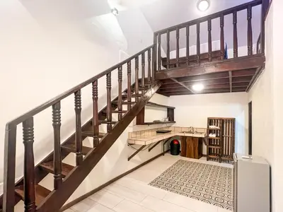 a staircase leading up to a room with white walls at Rio Lindo Hotel in Dominical