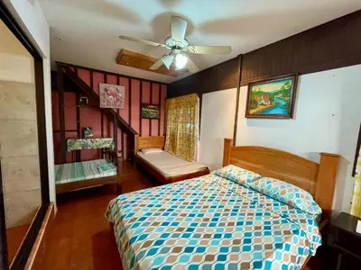 a bedroom with a bed and a ceiling fan at Casona de Pani habitacion#3 in Liberia
