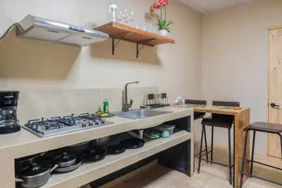 a kitchen with a sink and a stove at Marsol 2 in Uvita