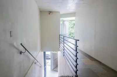 a hallway with a spiral staircase in a house at Marsol 2 in Uvita