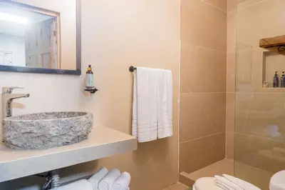 a bathroom with a sink and a shower at Marsol 2 in Uvita