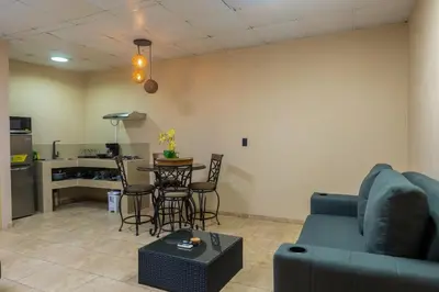 a living room with a couch and a table at Marsol 1 in Uvita