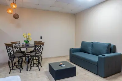 a living room with a couch and a table at Marsol 1 in Uvita