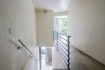 a hallway with a spiral staircase in a building at Marsol 1 in Uvita