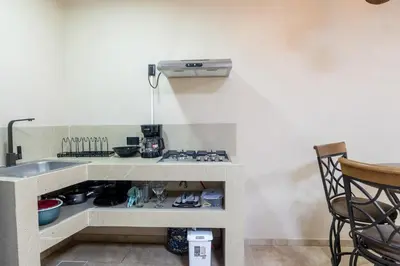 a kitchen with a sink and a counter top at Marsol 3 in Uvita