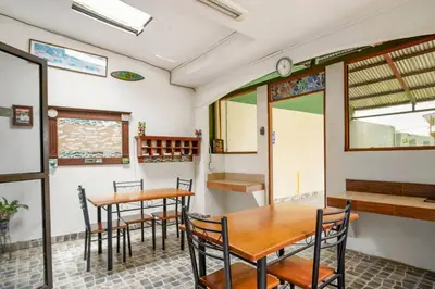 a dining room with two tables and chairs at Relaxing H-I Heredia Apartment in Flor