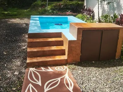 a plunge pool with stairs and a swimming poolvisor at Nature Observatory Studio with Private Pool in Chachagua