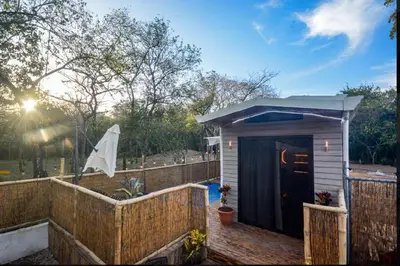 a small shed with a fence and a fence at Casita VNV in Nosara