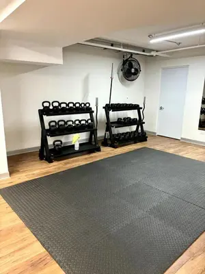 a room with two black rugs and a black rug at Serene and Modern Beachfront Condo with Ocean Views in Jacó