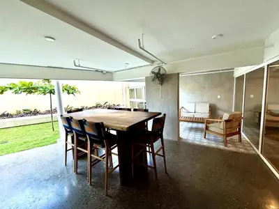 a dining room with a wooden table and chairs at Stunning Beachfront 1BR Suite with Ocean View in Jacó