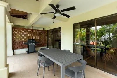 a dining room with a table and chairs at The Sky Deck Condo 2bed25bath in Coco