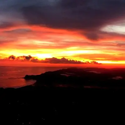 a sunset over the ocean with the sun setting at Villa Ocean Jungle View Infinity Pool Near Samara in Carrillo
